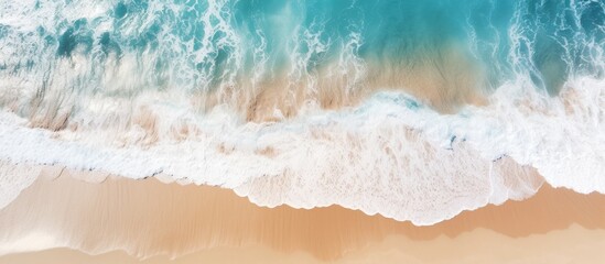 Wall Mural - Aerial view of ocean waves washing a secluded sandy shoreline beach. Copyspace image. Square banner. Header for website template