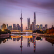 © Travel 'n' Lifestyle - View of Shanghai skyline at sunset, view of the financial district along the Huangpu River, China.