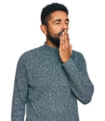 Wall Mural - Young african american man wearing casual clothes bored yawning tired covering mouth with hand. restless and sleepiness.