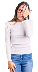 Wall Mural - Beautiful brunette young woman wearing casual white sweater and glasses yawning tired covering half face, eye and mouth with hand. face hurts in pain.