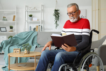 Sticker - Senior man in wheelchair reading book at home