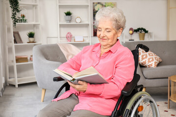 Poster - Senior woman in wheelchair reading book at home