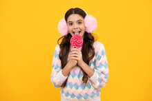 Teenager Girl Eating Sugar Lollypop. Candy And Sweets For Kids. Child Eat Lollipop Popsicle Over Yellow Isolated Background. Yummy Caramel, Candy Shop.