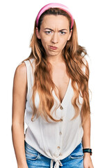 Canvas Print - Young caucasian woman wearing casual style with sleeveless shirt skeptic and nervous, frowning upset because of problem. negative person.