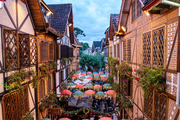 Swiss architecture in Campos do Jordão. Street with umbrella decorating cold tourist city of Sao Paulo at Christmas time in Brazil, window view