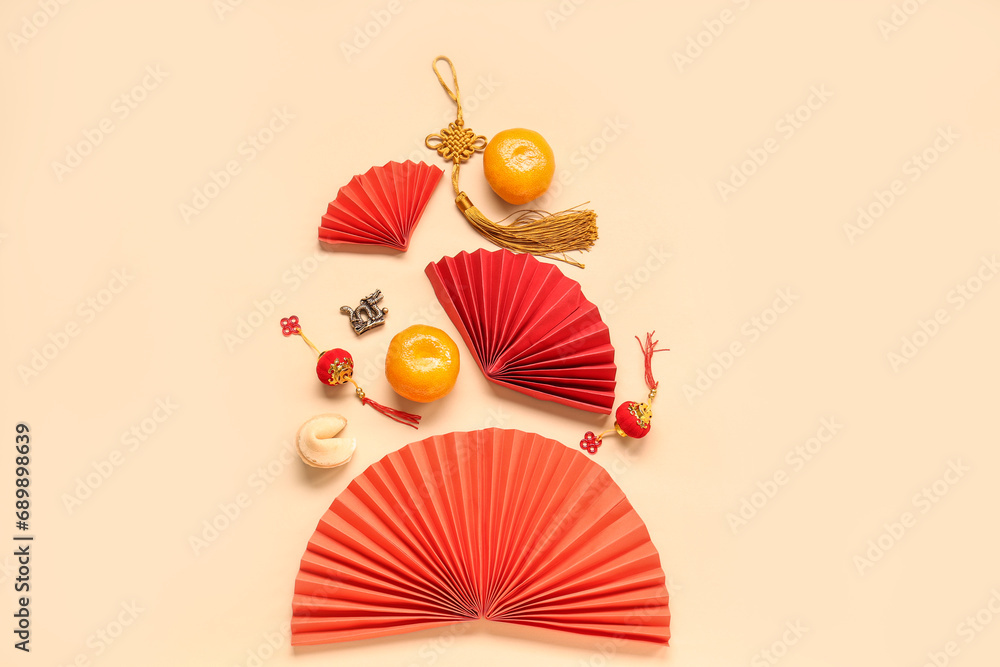 Fortune cookie with mandarins and Chinese symbols on beige background. New Year celebration