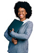 © Krakenimages.com - Young african american woman working using computer laptop winking looking at the camera with sexy expression, cheerful and happy face.