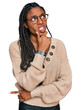© Krakenimages.com - African american woman wearing casual clothes thinking worried about a question, concerned and nervous with hand on chin