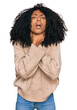 © Krakenimages.com - Young african american girl wearing casual clothes shouting and suffocate because painful strangle. health problem. asphyxiate and suicide concept.