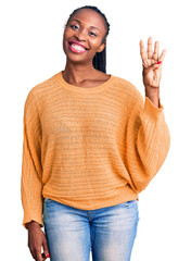 Wall Mural - Young african american woman wearing casual clothes showing and pointing up with fingers number four while smiling confident and happy.