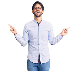 Poster - Handsome hispanic man wearing business shirt and glasses smiling confident pointing with fingers to different directions. copy space for advertisement