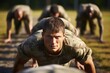 Youve gotta push through the pain. Shot of a group of men doing push-ups at a military bootcamp.
