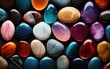 Colorful pebble stones on a black background. 