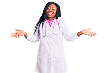 Canvas Print - Young african american woman wearing doctor stethoscope smiling showing both hands open palms, presenting and advertising comparison and balance