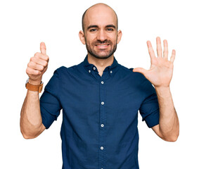 Poster - Young hispanic man wearing casual clothes showing and pointing up with fingers number six while smiling confident and happy.