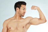 Fototapeta  - Fitness, bicep flex and asian man in studio for wellness, training or workout results on white background. Body, exercise and Japanese male model with strong arm pose for strength or muscle growth