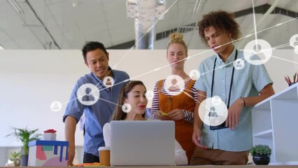 Canvas Print - Animation of network of connections with icons over diverse colleagues discussing work in office