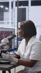 Poster - Female black girl using DNA monitor