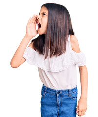 Wall Mural - Beautiful child girl wearing casual clothes shouting and screaming loud to side with hand on mouth. communication concept.