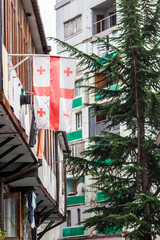 Sticker - travel to Georgia - Georgian flag on balcony of urban house in Batumi city