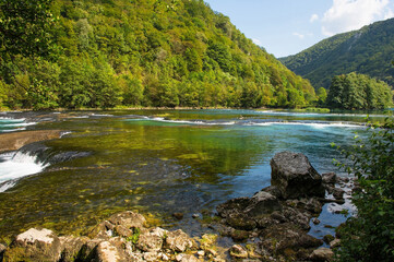 Wall Mural - Troslap Lohovo, a small waterfall in the River Una near Lohovo, Bihac in Una-Sana Canton, Federation of Bosnia and Herzegovina. Located within the Una National Park. Early September