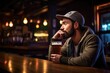 man quietly sipping an ipa at a bar