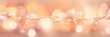 beautiful Christmas lights garland with bokeh lights  in color of the year 2024 peach fuzz