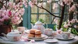 Elegant tea set with pastel macarons on a table, surrounded by blooming pink cherry blossoms. Vintage afternoon tea party concept.