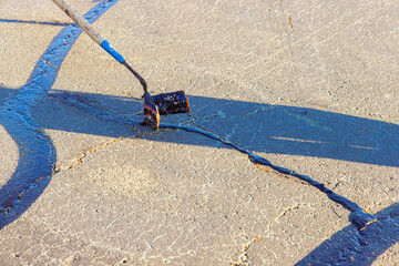 course of worker patching are filled, asphalt cracks are sealed, bitumen emulsion is applied to rest