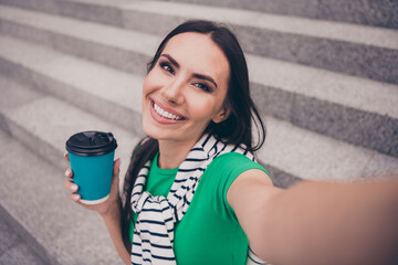 Sticker - Photo of cheerful lovely woman wearing stylish clothes recording video shooting walking town enjoying summer outside