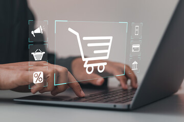 Wall Mural - online shopping concept.businessman using laptop with online shopping to digital cart from online st