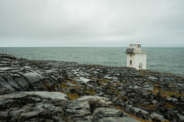 view of the black head lighthouse on the burren coast of county clare, ireland