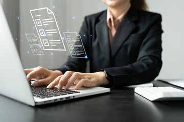 Wall Mural - Businesswoman working on a laptop computer to document management online documentation database digital file storage system software records keeping database technology file access doc sharing