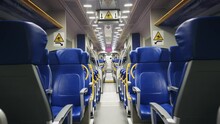 Traveler Walk Pov In An Empty Modern High Speed Train Driving On Night Route From Fiumicino Airport To Termini Railway Stantion In Rome