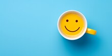 A Top-down View Of A Cup Of Coffee With A Smiley Face On A Blue Background.