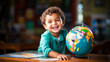 A young child smiling while exploring a colored globe, joyful moment