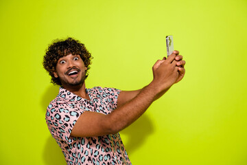 Sticker - Photo portrait of attractive young man gadget excited impressed wear trendy pink leopard print clothes isolated on yellow color background