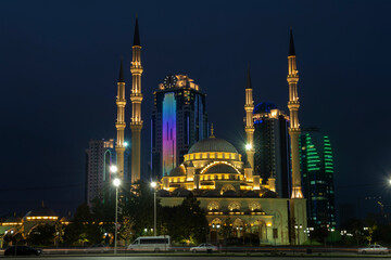 Wall Mural - The Heart of Chechnya Mosque against the background of the Grozny City complex on September night