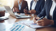 © Studio Nova - Group of businesspeople are engaged in a business meeting with analytics and laptop at the office desk.