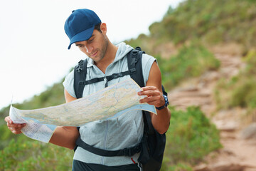 Canvas Print - Man, hiking and map for guidance, nature and direction on trail, fitness and exercise on holiday. Male person, lost and documents for information, travel and journey or adventure to forest for cardio