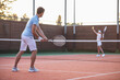 © georgerudy - Couple playing tennis
