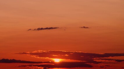 Wall Mural - The timelapse of the sunset captures the ever-changing beauty of the evening sky.