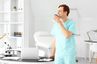 © Pixel-Shot - Male doctor drinking coffee in clinic
