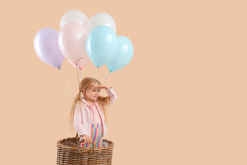 Sticker - Cute little girl with beautiful balloons and wicker bucket on beige background