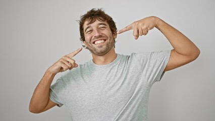 Poster - Joyful young man in casual t-shirt, pointing to his perfect teeth, showing off his dental health. laughing with his mouth wide, isolated on a white background. handsome guy with a fresh, clean smile!