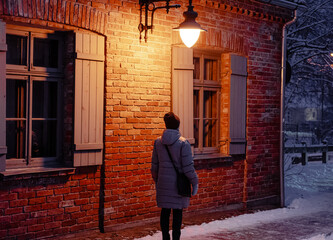 Wall Mural - Night street background with lantern on and person under it