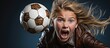 11-year old blond girl participating in football, using her head to hit the ball.