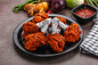 Indian cuisine glazed chicken lollipop