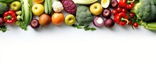 An Overhead View Of Healthy Fresh Organic Colourful Fruits And Vegetables Arranged On The Left Border Of The White Background Creates The Frame And Leaves Useful Copy Space For Text