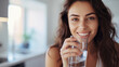 © AspctStyle - Healthy beautiful young woman holds a glass of water in kitchen, smiling young girl drinking fresh water from glass